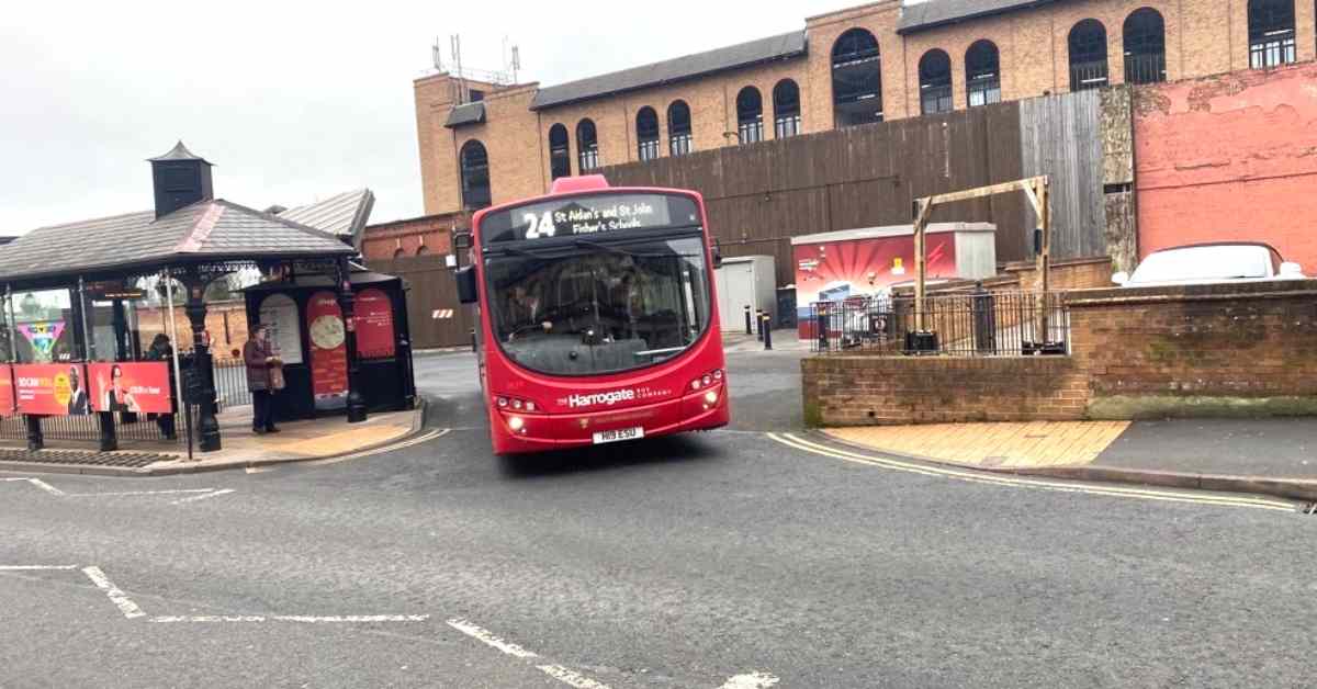 A phot of a bus leaving Harrogate bus station.