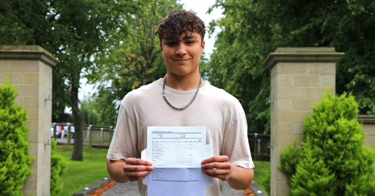 Rhys Wolf collects his GCSE results from Ashville College