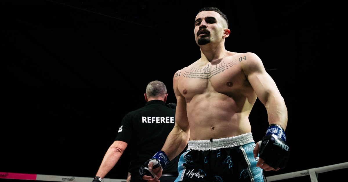 Photo of Knaresborough muay thai fighter Nathaniel Kalogiannidis walking back to his corner of the ring during his bout against Dan Bonner in February 2024.